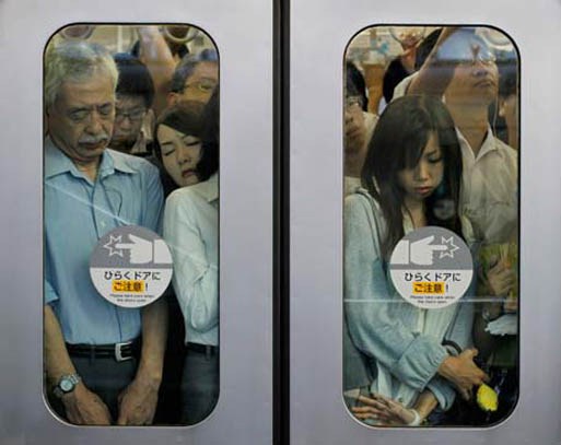 Crowded Tokyo Subway. Photo Credit: Michael Wolf